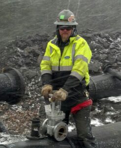 Image of Justin Koschak working in the field.